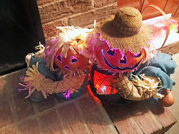 two pumpking heas scarecrows