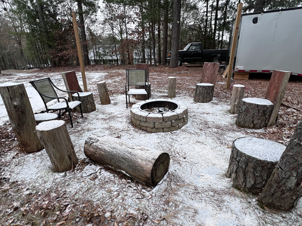 fire pit covered in snow