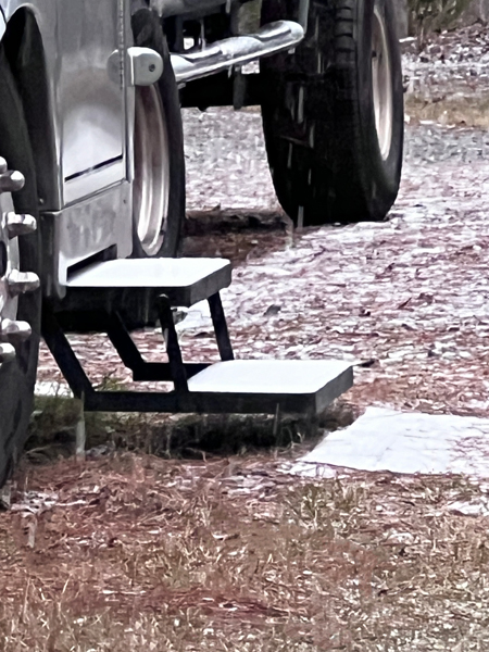 RV steps covered in snow