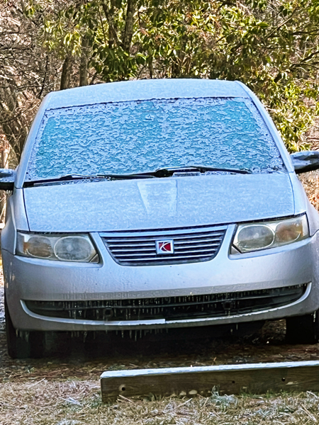 snow coverd car