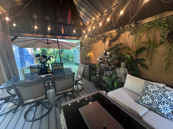 table, chairs, couch and more in the tent area