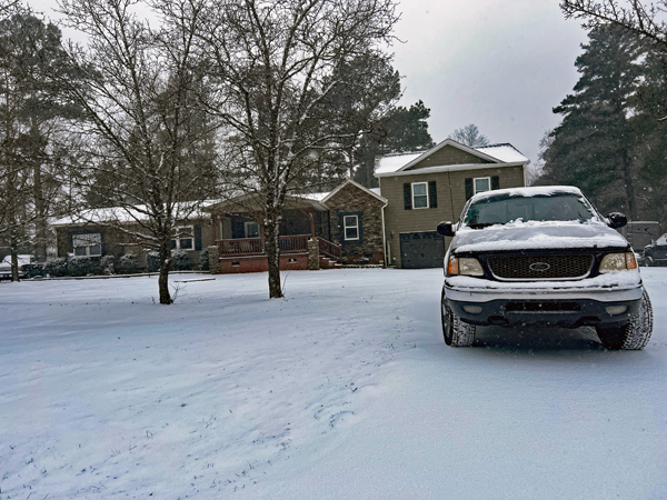 snow, car and a house
