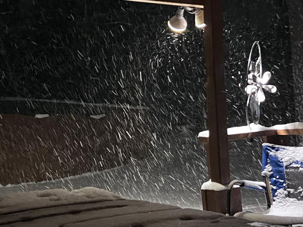 snow over the hot tub