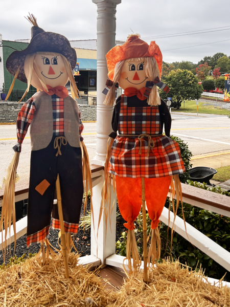 2 scarecrows in the town square