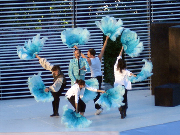 male performer with feathers