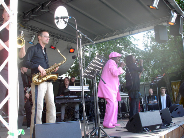 singer in a pink suit