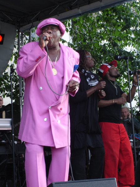 singer in a pink suit