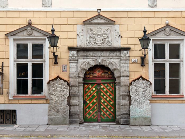 a colorful green and ornate door