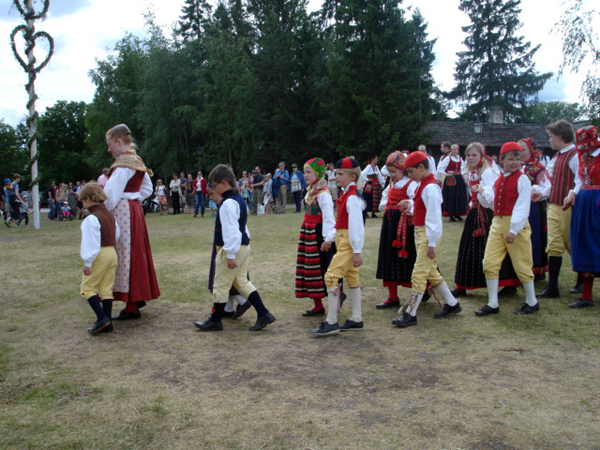 Swedish folk festival parade around the Maypole