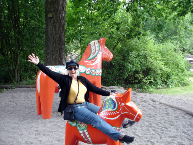 Karen Duquette on a Dala horse