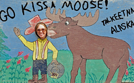 Karen Duquette being  kissed by a moose