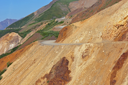 a twisty road and steep cliff