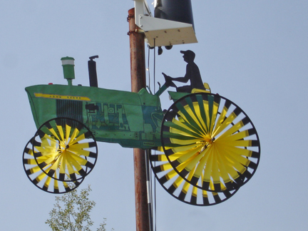 a lightpole and a "tractor" with spinning wheels