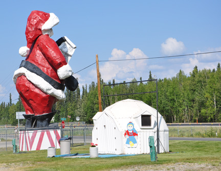 Santa Clause statue and  an igloo