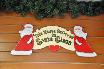 sign - This House Believe's in Santa Claus