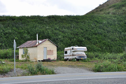 a small RV and small cabin