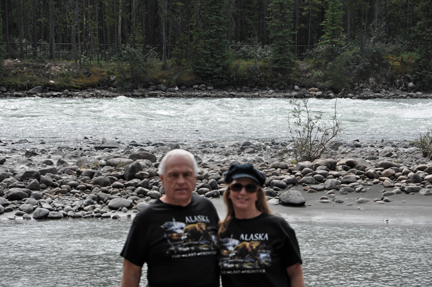 the two RV Gypsies and Athabasca River at top of the falls