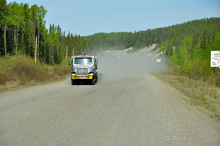 semi-truck throwing gravel at the two RV Gypsies