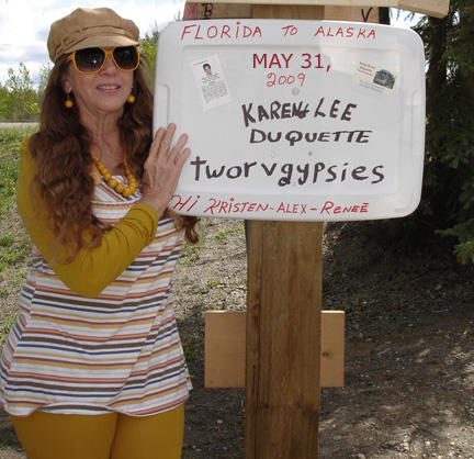 Karen Duquette with the sign for the two RV Gypsies