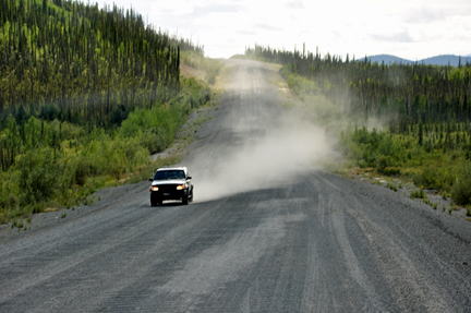 bad road - car coming throwing dust