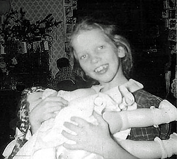 Karen holding a doll