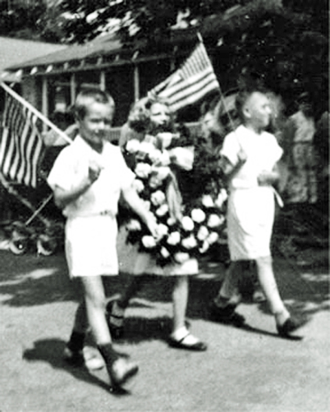 Karen carrying the wreath in Memorial Day Parade