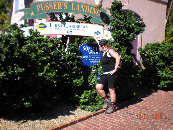 Karen Duquette at Soper's Hole Wharf sign