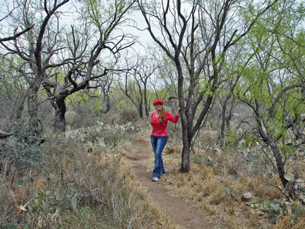Karen hiking among the cacti