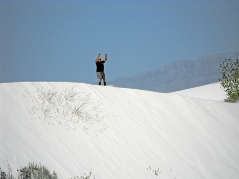 Lee at the top of the white sand dune