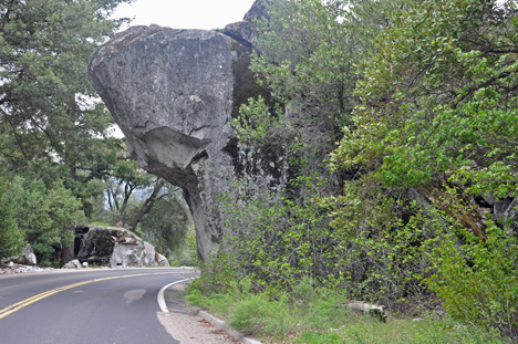 a rock formation over the road