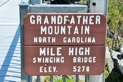 sign on the swinging bridge
