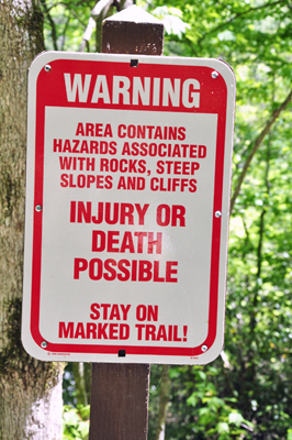 warning sign on the trail