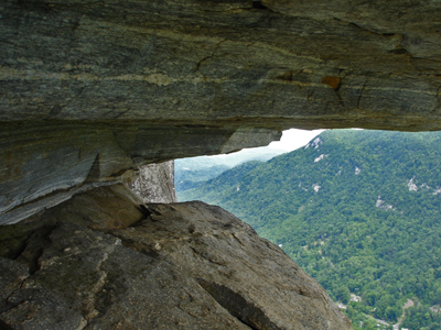 a rock overhang with a narrow horizontal opening