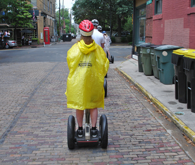 Karen Duquette on a Segway in the rain
