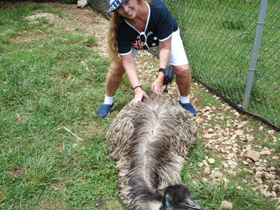 Karen Duquette petting an emu