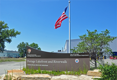 Welcome sign for Portage Lakefront and Riverwalk