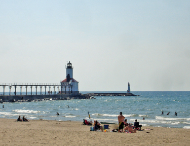 Michigan City Lighthouse and beach-goers on Lake Michigan