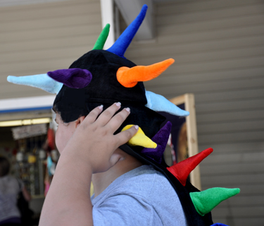 Alex tried on some silly hats