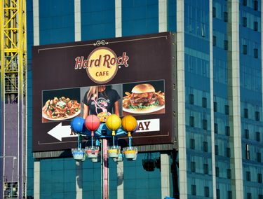 Hard Rock Cafe sign and balloon carosel floating by it