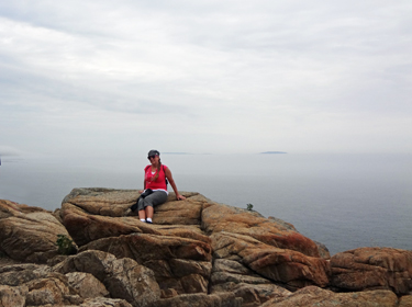Karen Duquette takes a break from climbing on the rocks