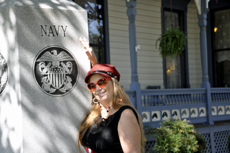 Karen Duquette and a U.S. Navy plaque