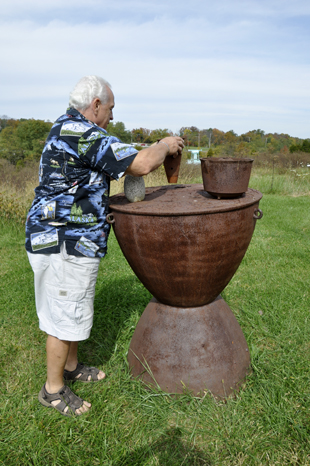 Lee Duquette testing the Turtle Island Drum sculpture