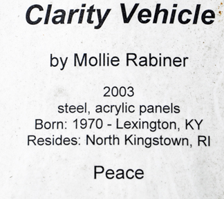 sign about the Clarity Vehicle sculpture