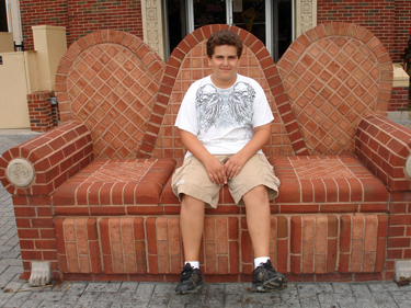 Alex on a brick couch