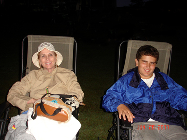 Karen Duquette and her grandson, Alex in the rain at the laser show at Stone Mountain