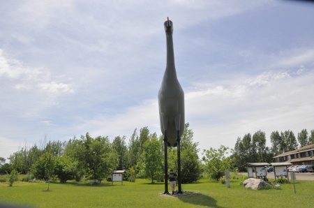 Karen Duquette stands by the World's Largest Sandhill Crane statue 