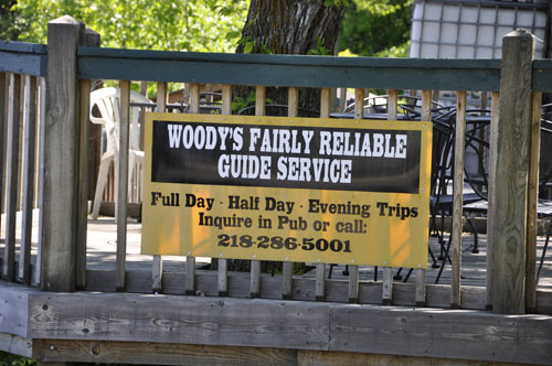 sign: woody's Fairly Reliable Guide Service