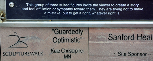 sign: Guardedly Optimistic sculpture