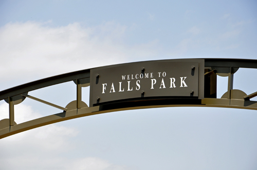 Welcome to Falls Park sign on a bridge