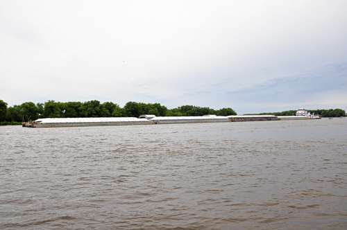 a long barge on the Mississippi River in La Crosse